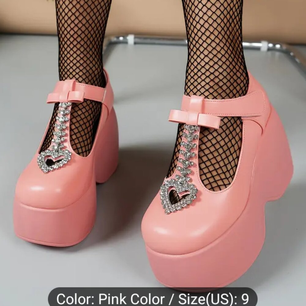 Woman's size 9 pink platform shoes with rhinestone heart embellishments